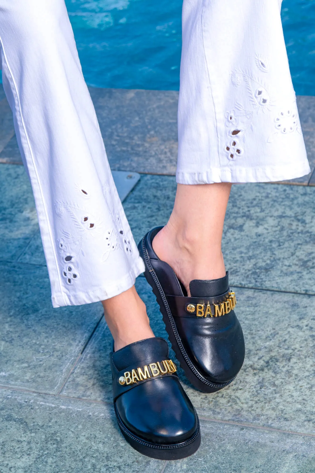 Black Leather Slide-On Loafers with Gold Logo Detail